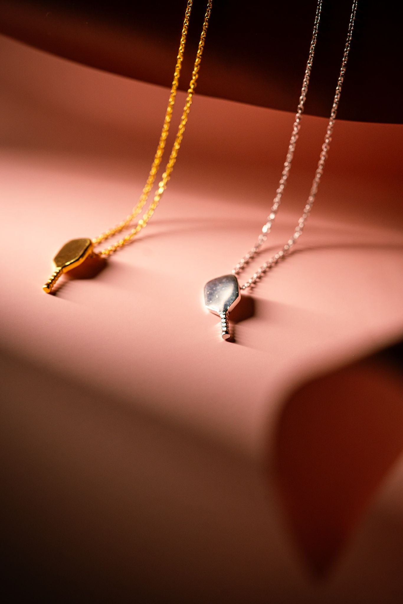 Plain paddle pendant in silver and gold by Mayfair Jewellers